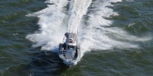 Silve Ships Ambar Series AM 1100 police boat hitting ocean waves